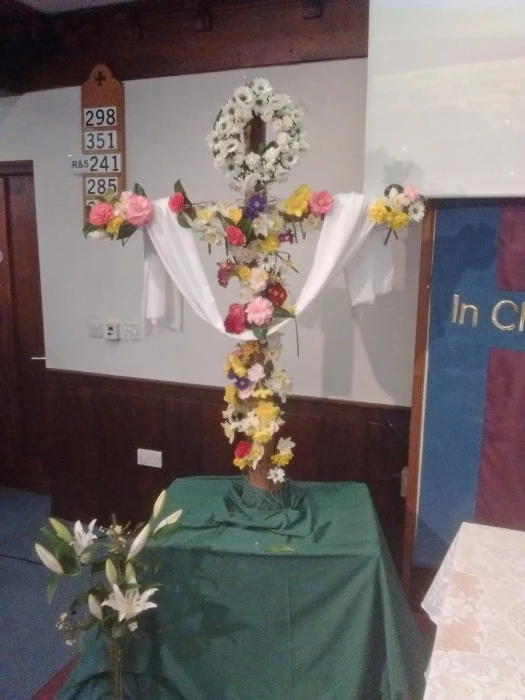 2 lenten cross  is decorated with flowers for easter day at trinity