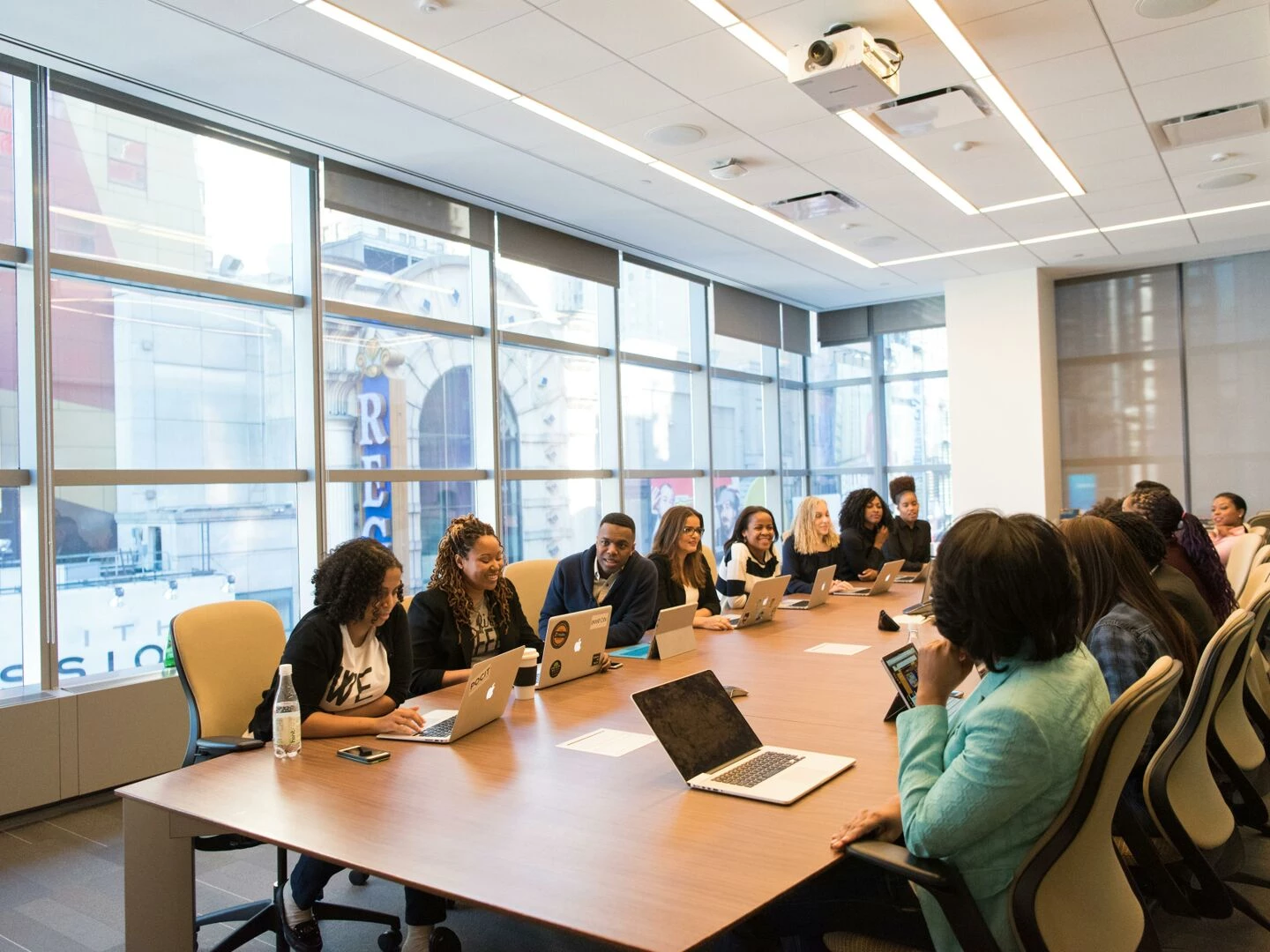 a diverse team of business professionals collaborating in a modern meeting room