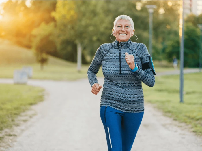 a woman running in a park