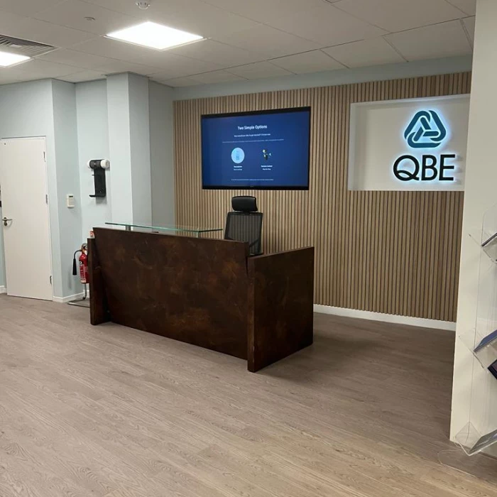 approaching the new reception area at the qbe offices in leeds