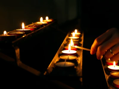 Lighting candles in church