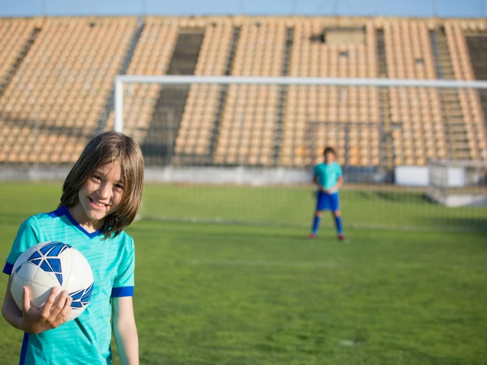 Kid Holding the Soccer Ball