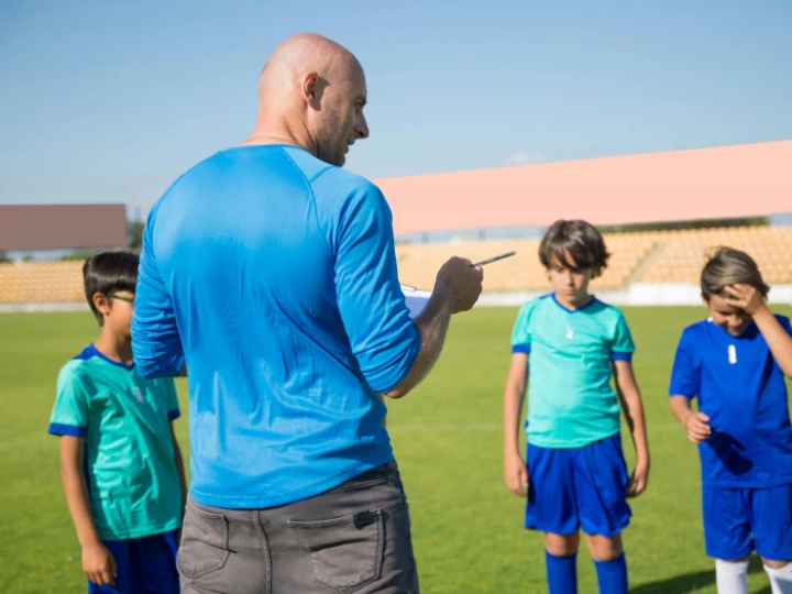 A Man Coaching His Team on the Field