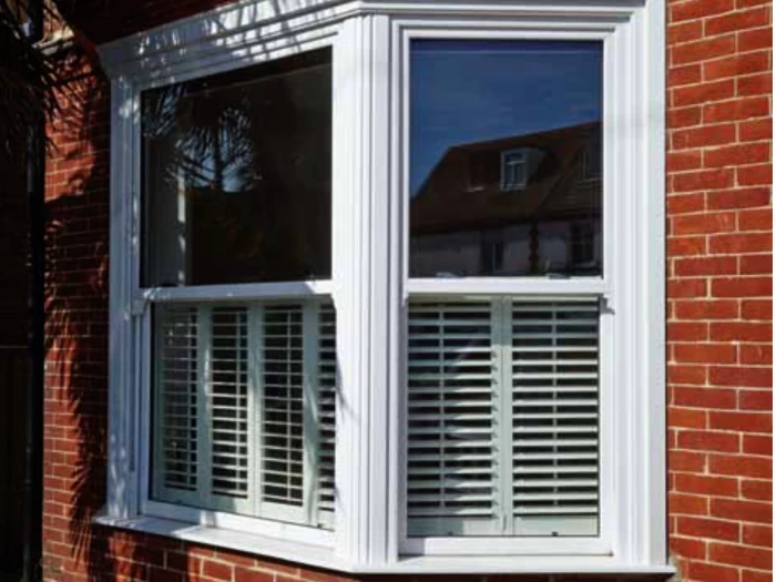 Sash window with red brick and blinds