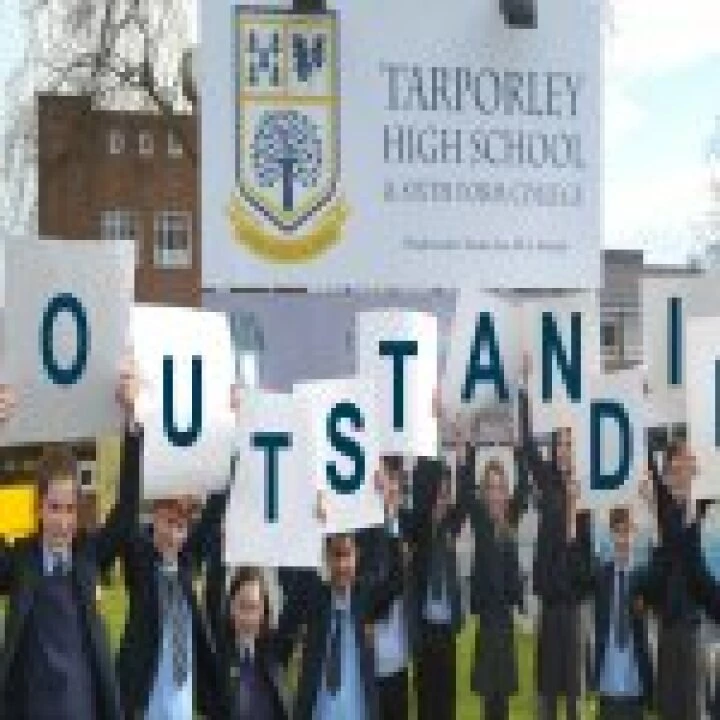 Students Holding Outstanding Letters Smaller