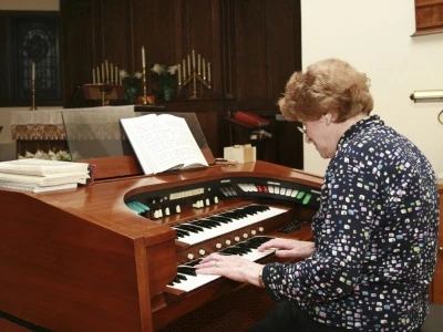 woman playing organ