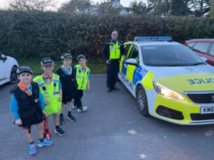 Beavers outside police car Oct 2023 Photo 2023 10 09 20 28 50