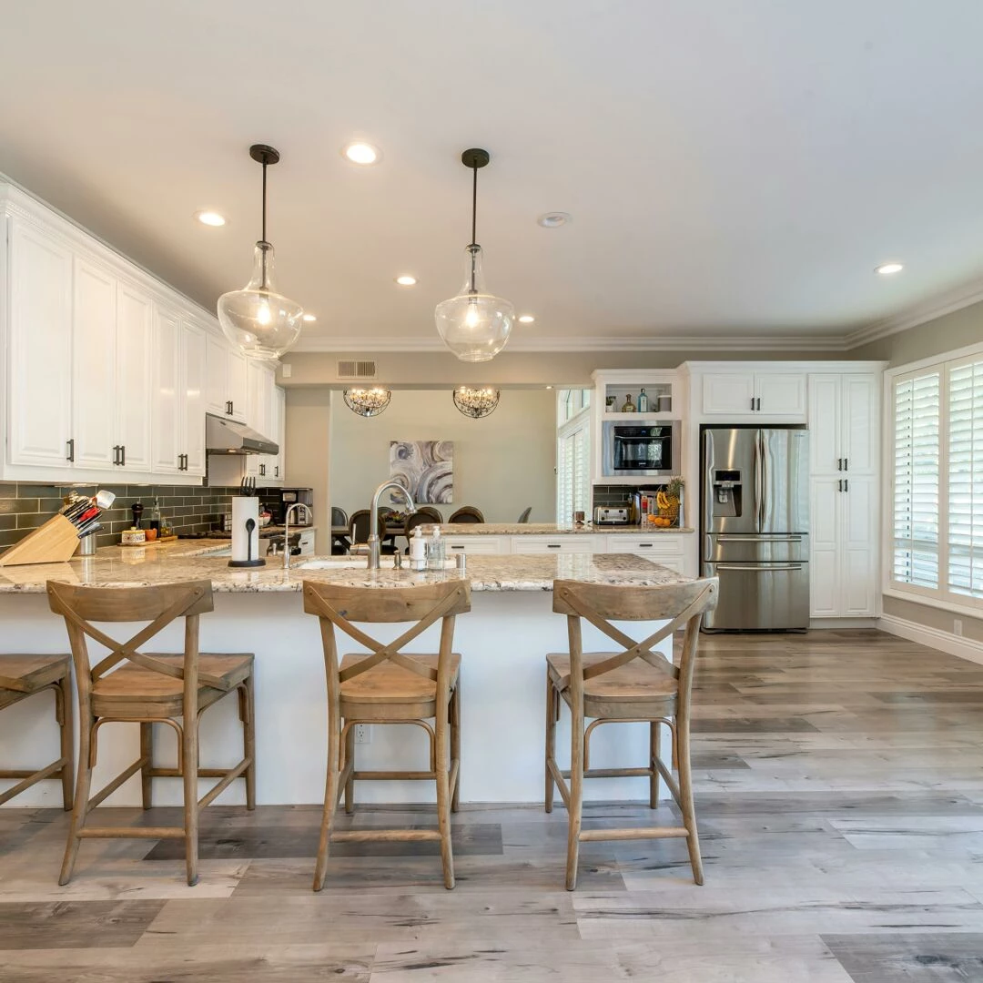 bright and spacious kitchen interior featuring bar stools and modern design elements