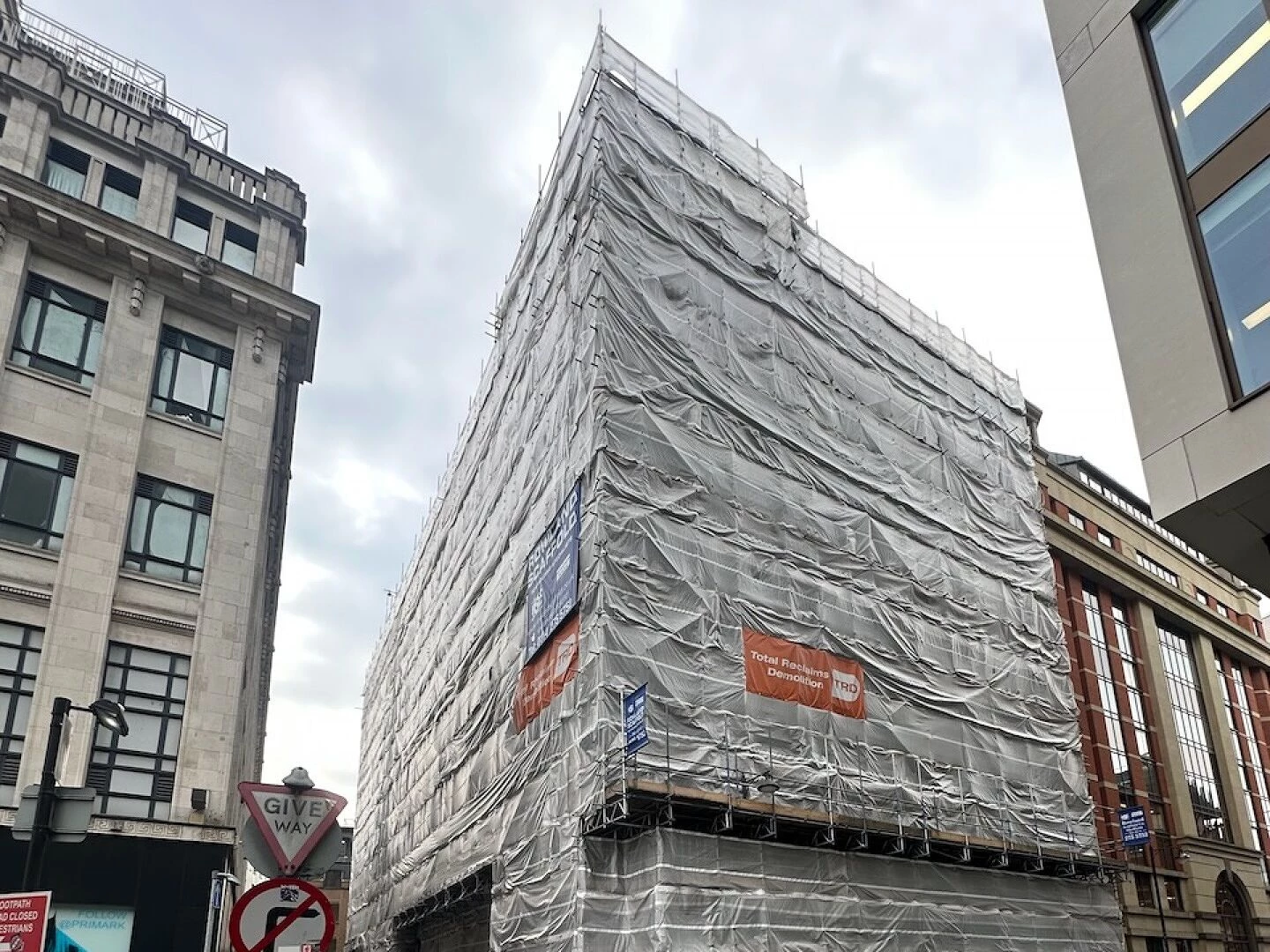 city building covered in scaffolding for renovation