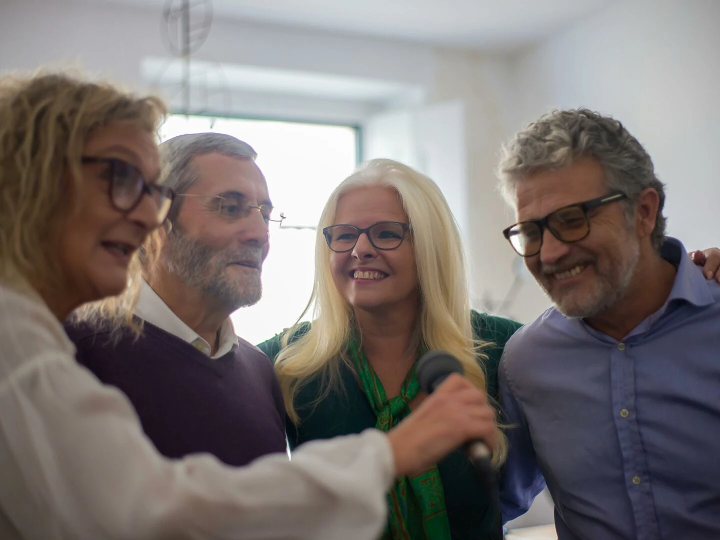 elderly friends singing together