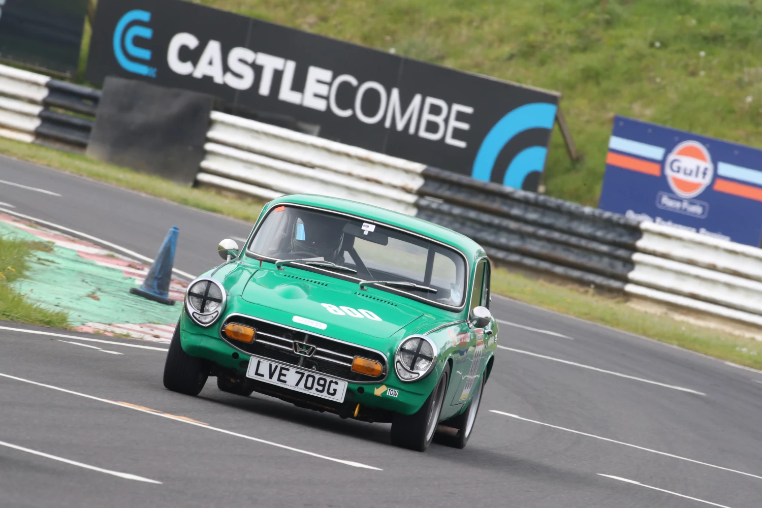 green race car with castle combe logo april 2024