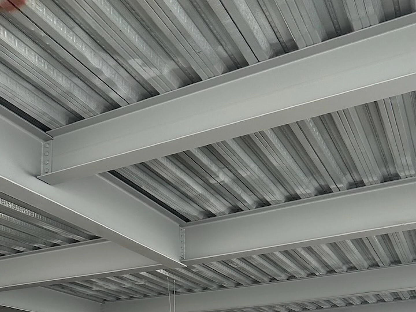 large empty industrial space with metal roof