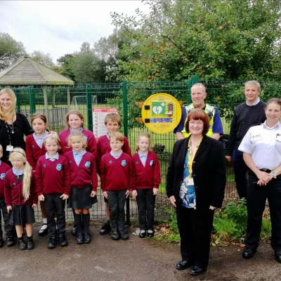 mrs c middleton head teacher with enthusiastic pupils