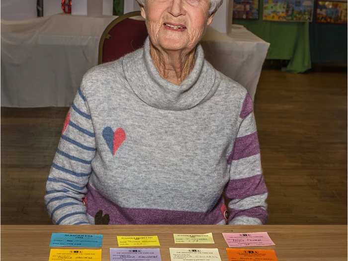 pam edwards with her membership cards from the start