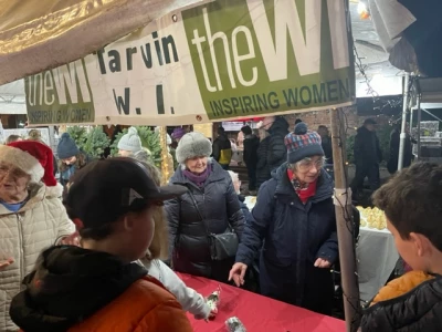 penny rees and heather excel on the wi tombola tarvin christmas market 2022