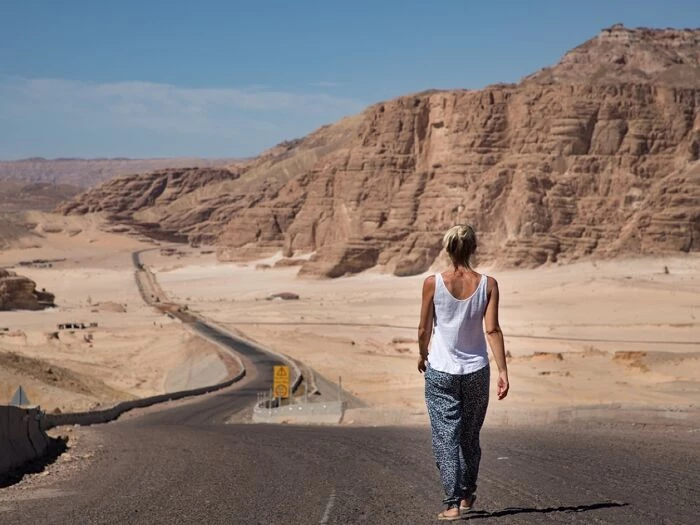 woman walking desert